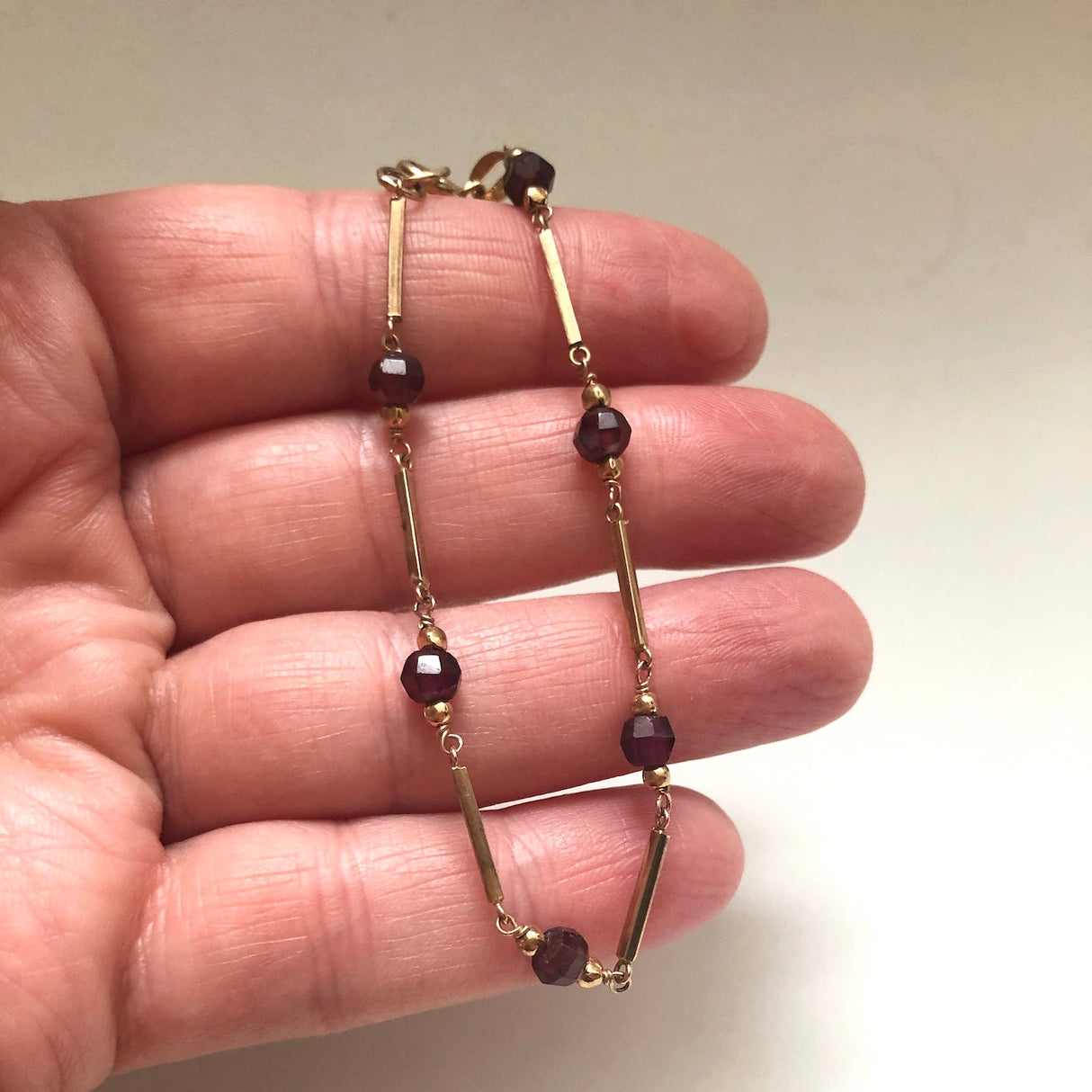 9k Gold Link Vintage Bracelet with Garnet Beads The Vintage Jewellery Company