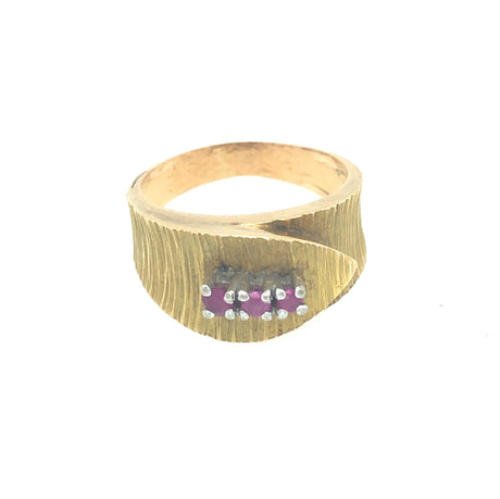 Vintage gold wrapover belt ring with engraved detail and set with three rubies The Vintage Jewellery Company