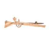 shot gun brooch gold